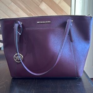 Burgundy Michael Kors purse.